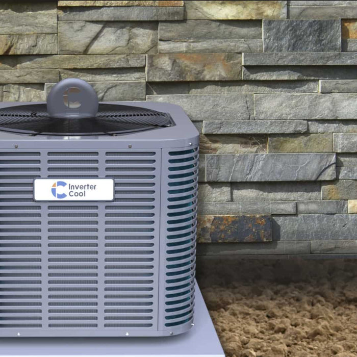 An InverterCool A/C heat pump is next to a residential home
