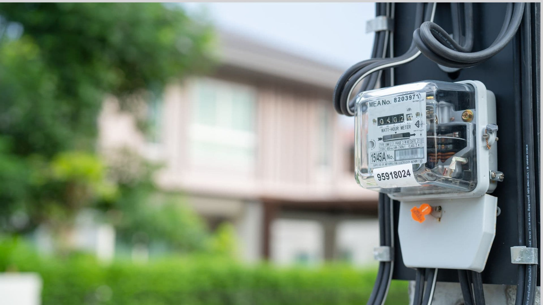 An electricity meter on a pole tracking household electricity usage