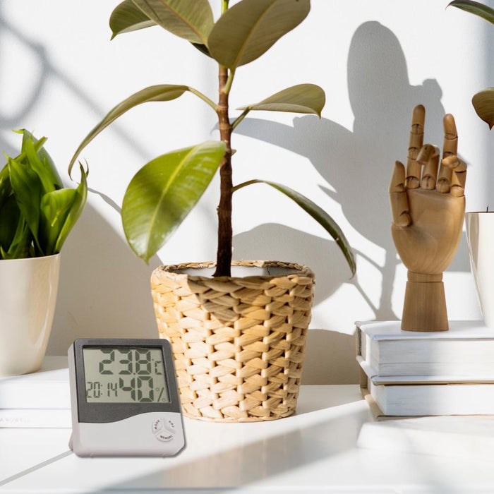 A Hygrometer on the table monitors the home humidity level